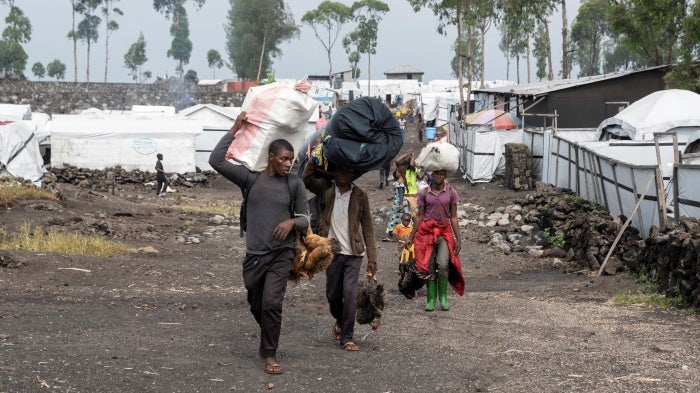 Civilians flee the Nzulo camp to Goma.