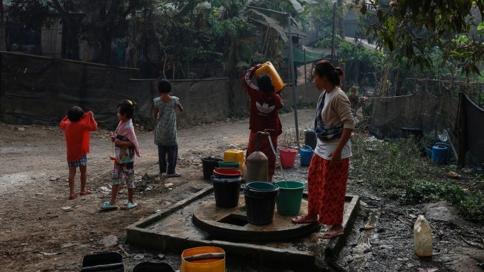 Refugees collect water at Mae La refugee camp in Thailand