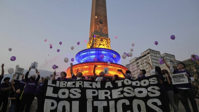 Activists and relatives of prisoners release balloons calling for the freedom of political prisoners, in Caracas, Venezuela, April 14, 2025.
