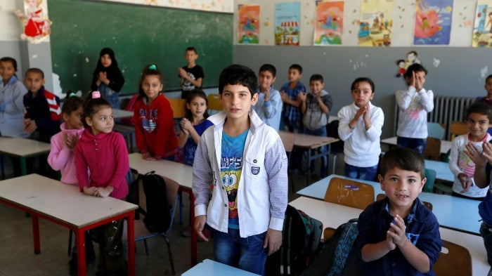 Syrian refugee children attend a class at a school in Mount Lebanon, October 7, 2016.