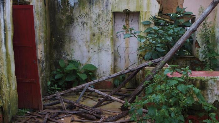 A home in the rural area of Municipality San Carlos Antioquia abandoned by persons displaced by violence, with graffiti of a woman’s body left by armed groups.