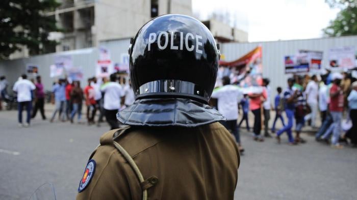 A Sri Lankan policeman keep