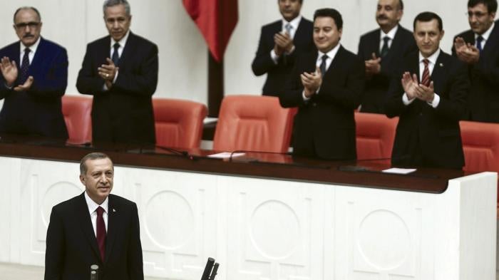 Turkey's new president Tayyip Erdoğan (front) attends a swearing in ceremony in parliament in Ankara on August 28, 2014