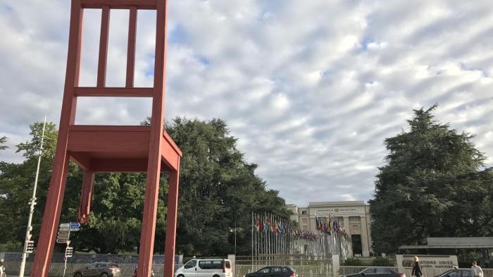 The Broken Chair, a statue in support of the bans on landmines and cluster munitions, stands outside the United Nations in Geneva.