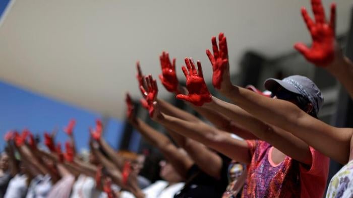 Demonstrators attend a protest against rape and violence against women in Brasilia, Brazil, May 29, 2016. © 2016 Reuters