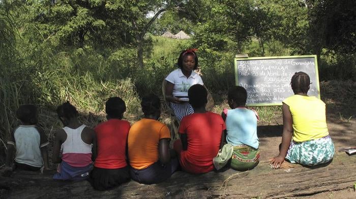 Mozambican girls take part in a lesson as part of a program that aims to help girls stay in school longer and stay out of child marriage