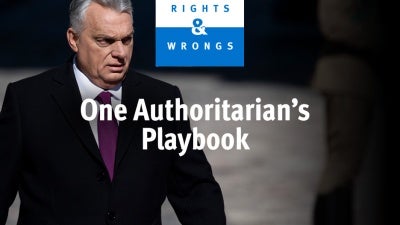 Viktor Órban looks away from camera, under logo and episode title. 