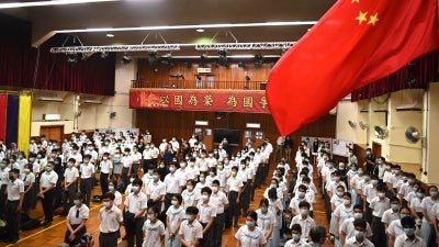 A flag raising ceremony on National Security Education Day at a secondary school in Hong Kong, China, April 15, 2021.