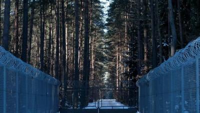 Barbed wire fence surrounding a military area