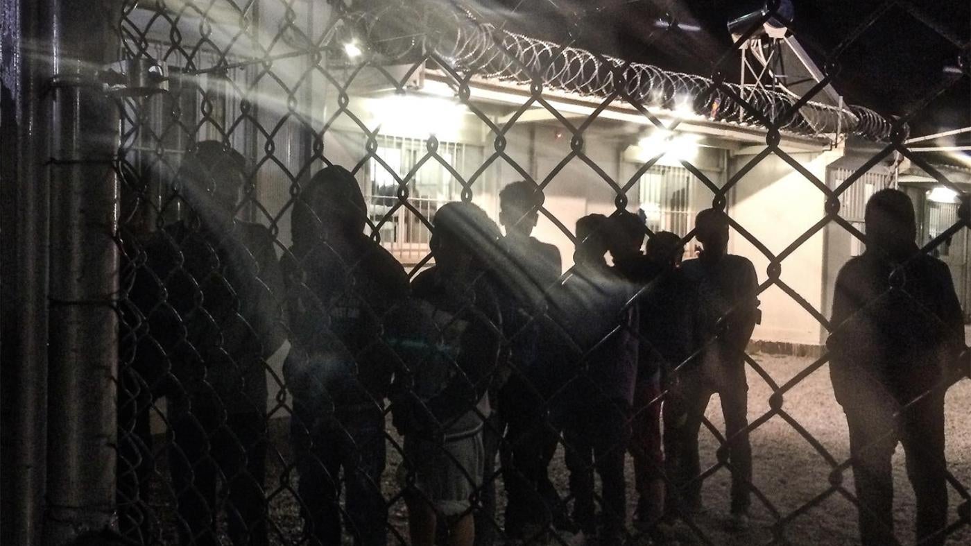 Unaccompanied children line up for an evening meal at a detention facility run by the Greek police.