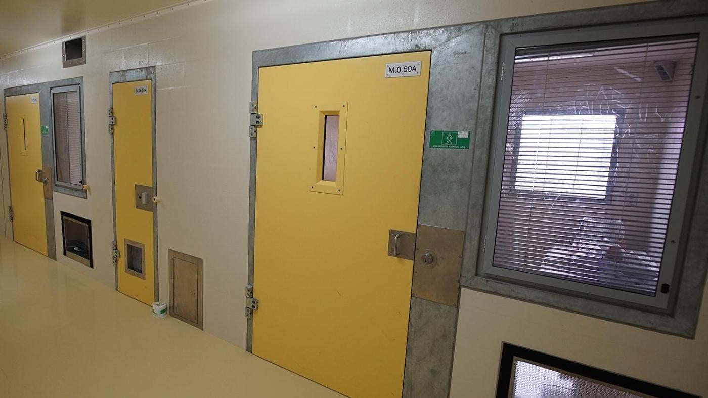 A prisoner lies in his solitary confinement cell in the safety unit at Lotus Glen Correctional Centre, northern Queensland.  