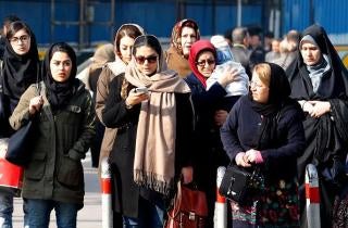 Iranian women walk down a street in the capital Tehran on February 7, 2018.