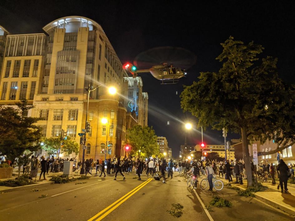 A US military UH-72A “Lakota” hovers low over protesters on June 1, 2020 in Washington, DC, battering them with its rotor wash and sending debris flying.