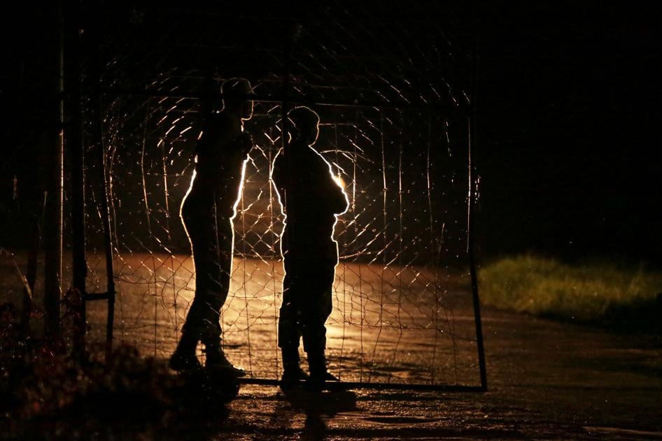 Armed Zimbabwean prison guards are seen at the entrance of Chikurubi prison on the outskirts of Harare, January 30, 2019.