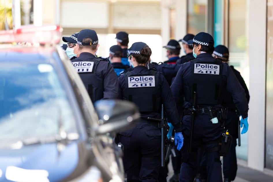 Police Public Order Response Teams respond to a small group of protesters who appeared at a shopping center and quickly dispersed before any arrests could be made during pop-up protests on September 20, 2020 in Melbourne, Australia. 