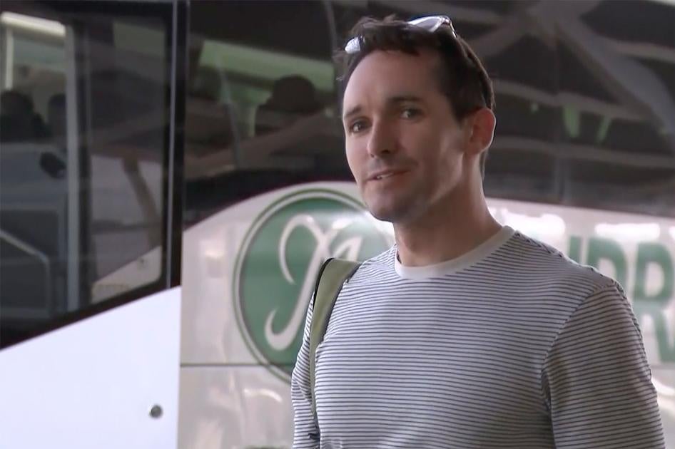 In this image made from a video, Australian Broadcasting Corp. journalist Bill Birtles speaks to the media on his arrival at Sydney airport, Australia, September 8, 2020.