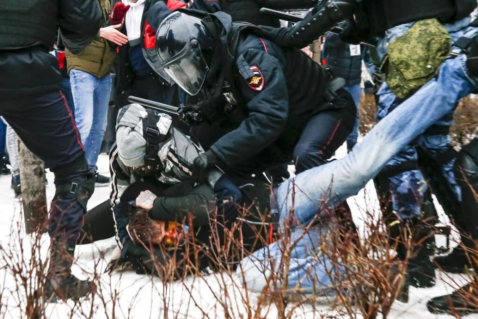 Riot police detain a demonstrator with a bloody face during a protest against the jailing of opposition leader Alexei Navalny in Pushkin Square, Moscow, Russia, Saturday, January 23, 2021. 