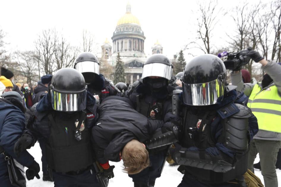Police officers detain a protester during a rally in support of Alexei Navalny in St. Petersburg, Russia, on January 23, 2021. 