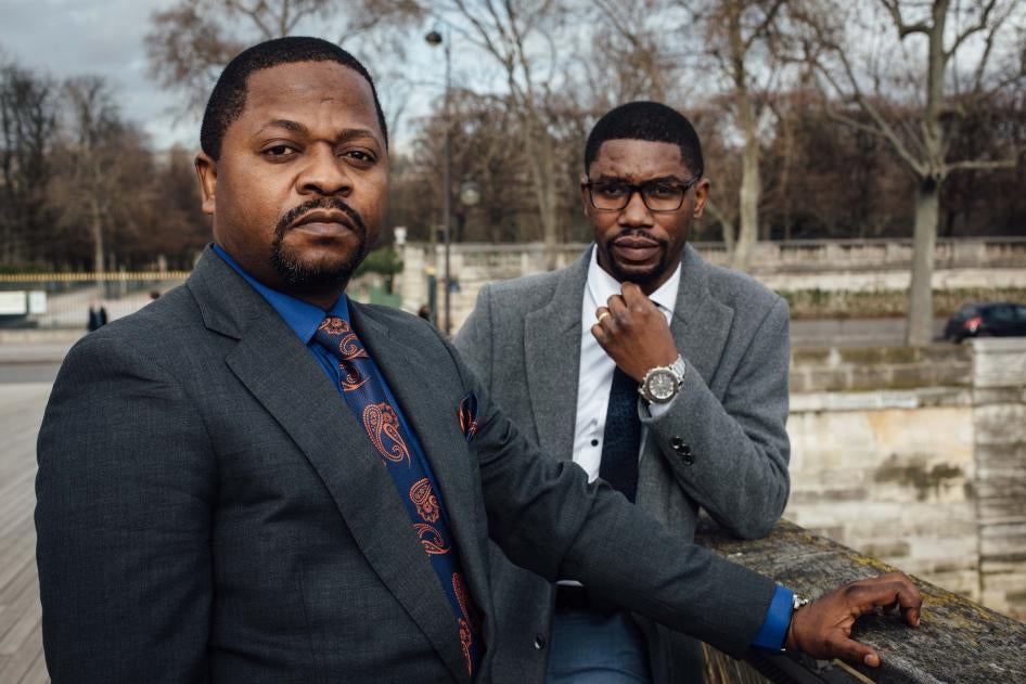 Gradi Koko, right, and Navy Malela, former staff of the audit department at Afriland First Bank CD, on February 17, 2021 in Paris, France.