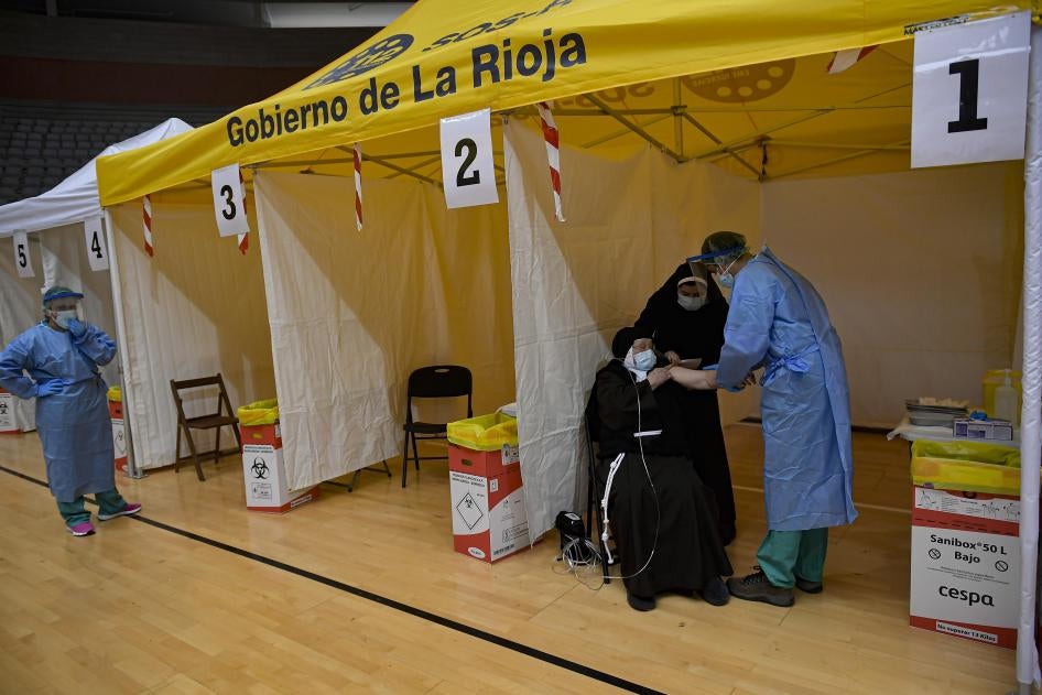 94-year-old Mother Teresa Llona receives a Pfizer vaccine during a Covid-19 vaccination campaign at the bull ring in Arnedo, northern Spain, March 4, 2021. 