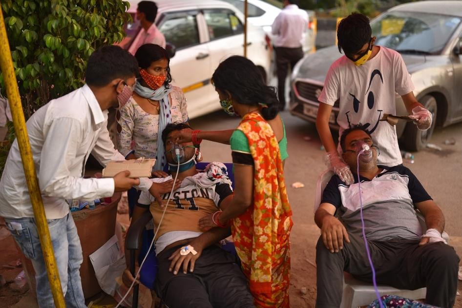 People suffering from breathing problems receive free oxygen support at a gurdwara, a place of assembly and worship for Sikhs, amidst the spread of the coronavirus disease, in Delhi, India. 