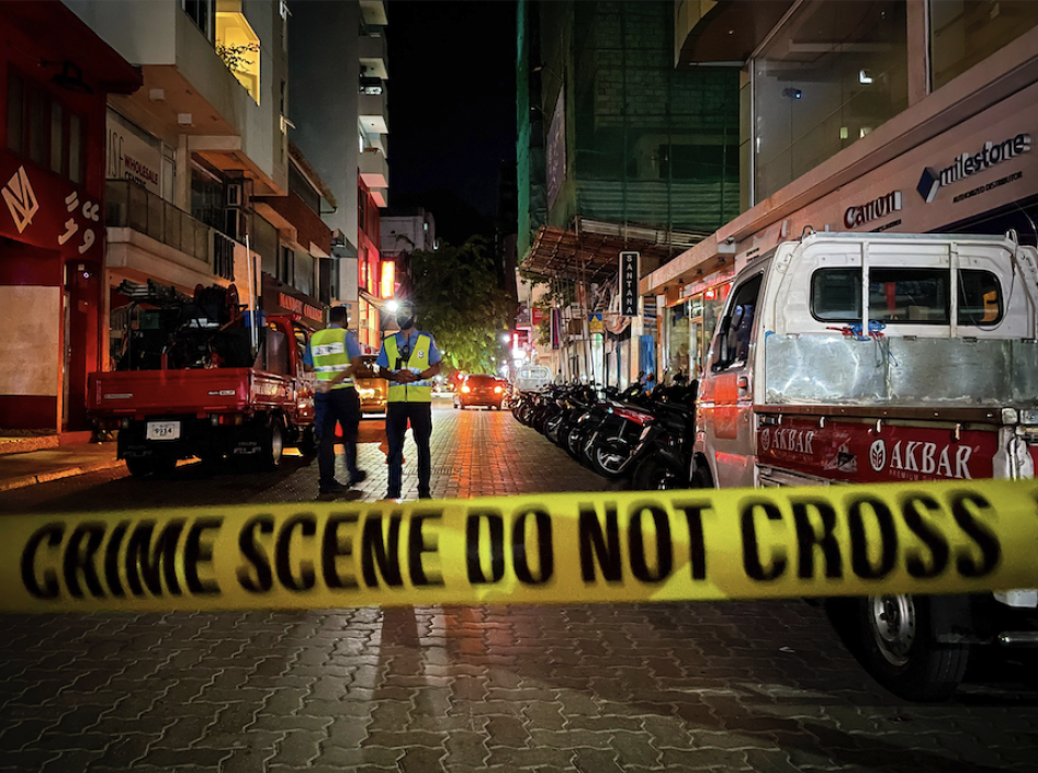Maldivian police officers secure the area following a blast in Male, Maldives, Thursday, May 6, 2021. Maldives' first democratically elected president and current Parliament Speaker Mohamed Nasheed has been injured in a blast Thursday near his home and was being treated in a hospital in the capital, police said. (