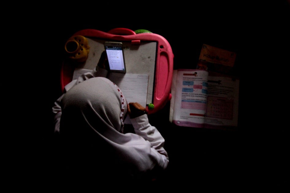 An overhead shot of a student on a cell phone