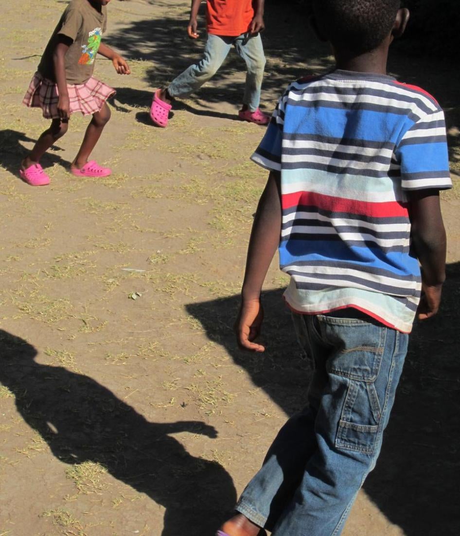 Children play in a backyard