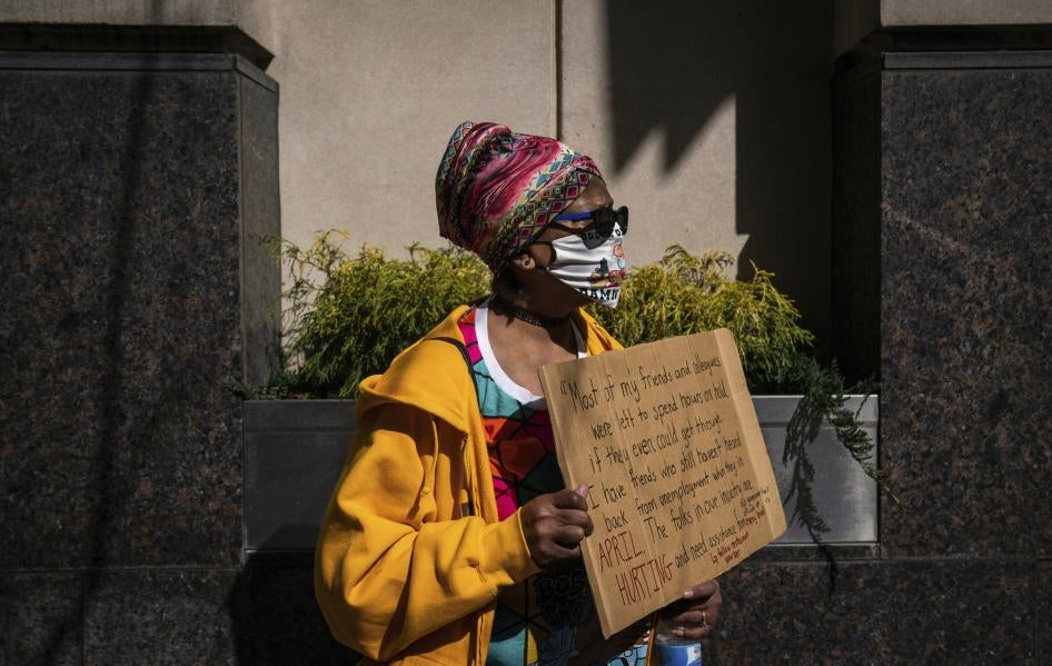 Gina Stanton, of the Homewood neighborhood in Pittsburgh, Pennsylvania, attends a rally held by the Mon Valley  Unemployed Committee and Pittsburgh Restaurant Workers Aid Group at Governor Tom Wolf’s regional office on March 10, 2021, downtown Pittsburgh.