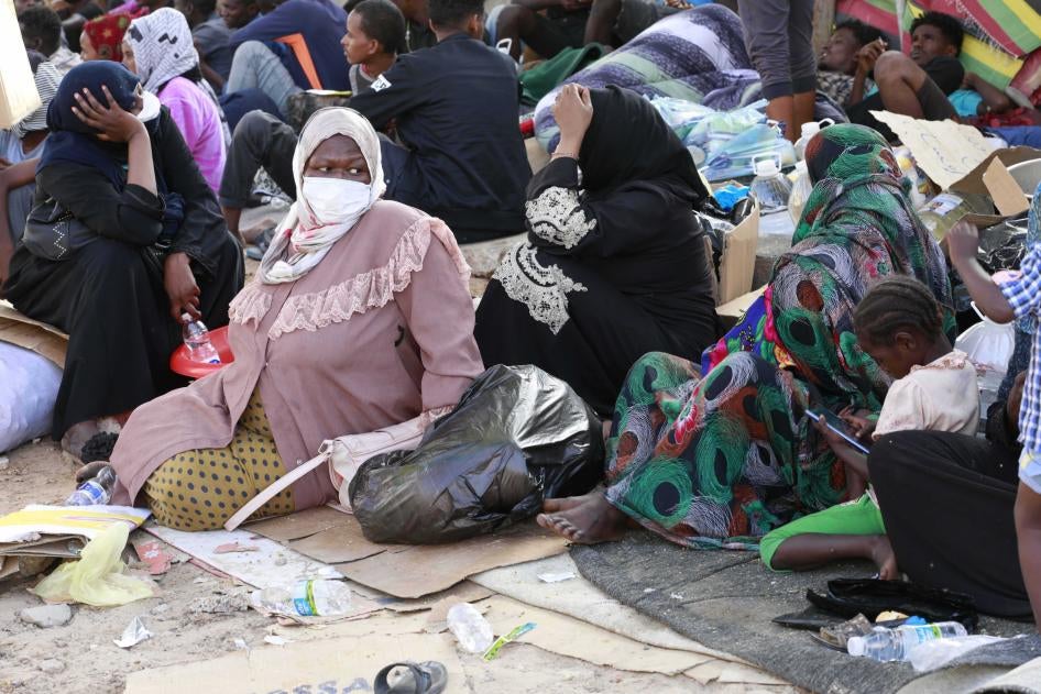 Asylum seekers and refugees camped in front of a shuttered facility managed by the United Nations High Commission for Refugees (UNHCR)  in Tripoli,