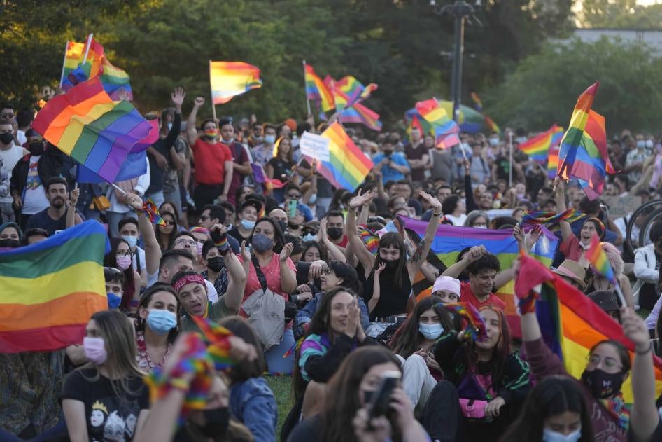 Chileans celebrate after lawmakers passed legislation legalizing marriage for same-sex couples, in Santiago, Chile, Tuesday, Dec. 7, 2021. (AP Photo/Esteban Felix).