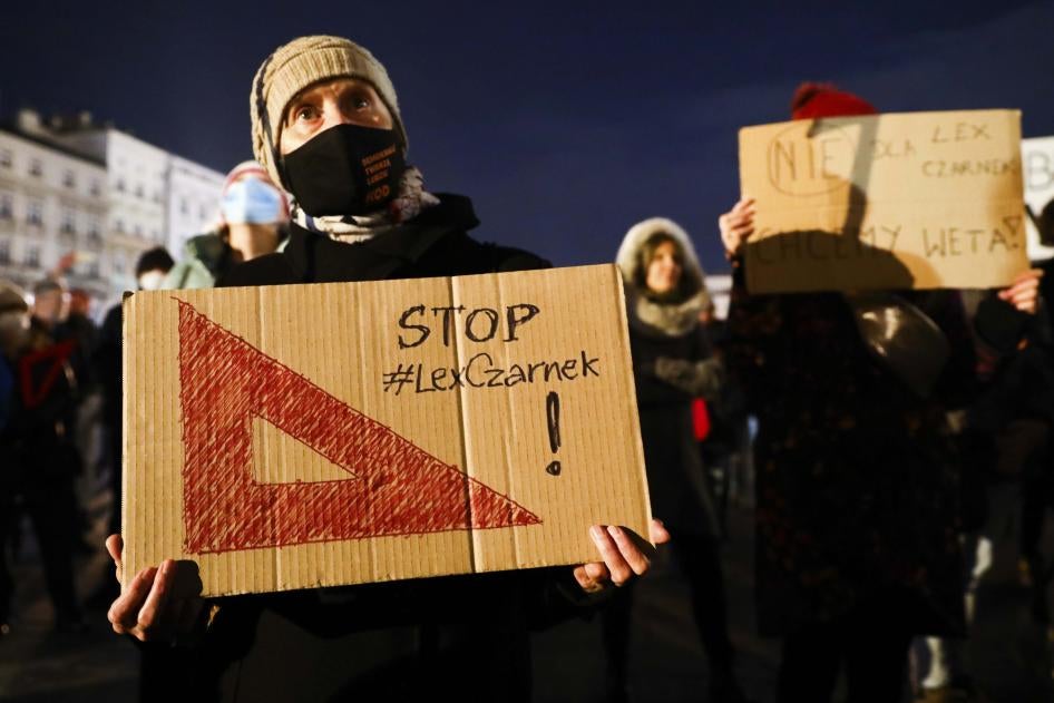 People attend 'Stop Lex Czarnek' protest at the Main Square in Krakow, Poland on February 15, 2022.