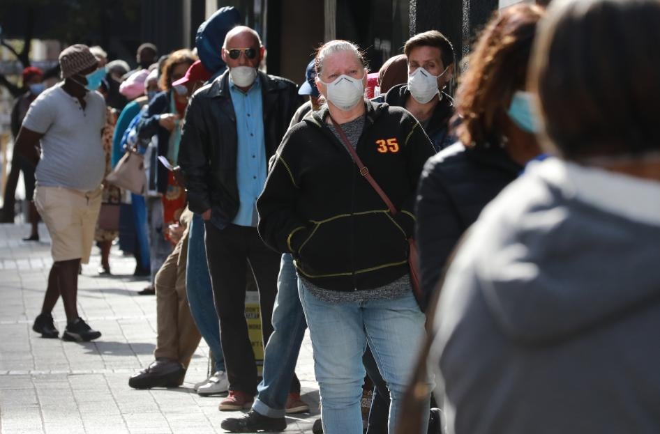 People standing in line to receive benefits at a South African Social Security Agency building in Cape Town, South Africa.