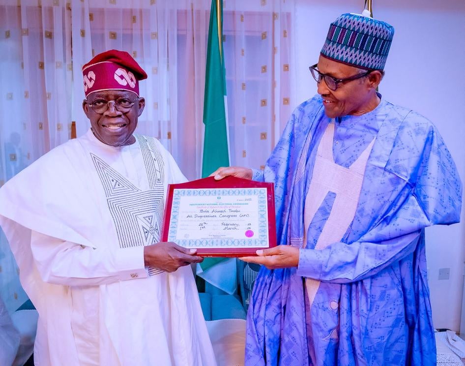 Nigerian President Muhammadu Buhari (R) and Nigeria's newly declared winner of 2023 presidential election, Bola Ahmed Tinubu (L) pose for a photograph in Daura, Nigeria, March 1, 2023. 