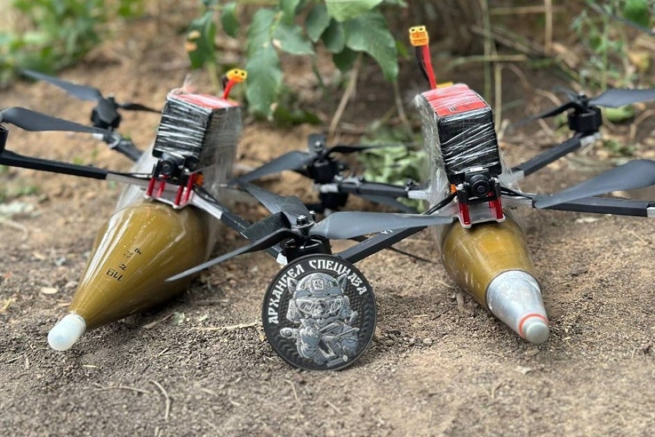 two VT-40 drones with a munition taped to each of the airframes