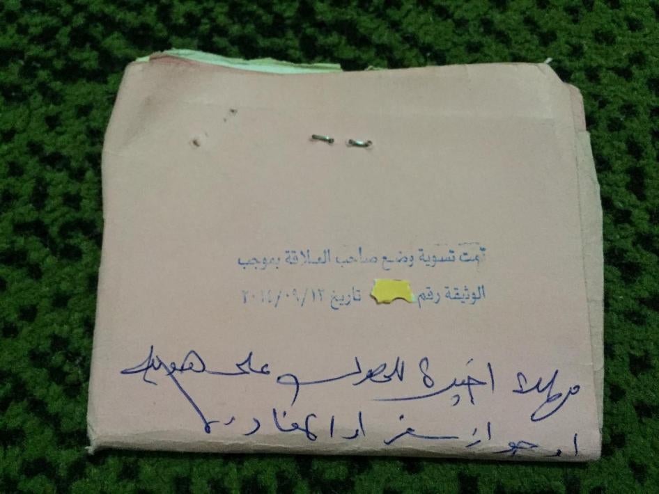 The order written on Amin’s expired residency papers: “Last chance to get ID or passport or to leave."