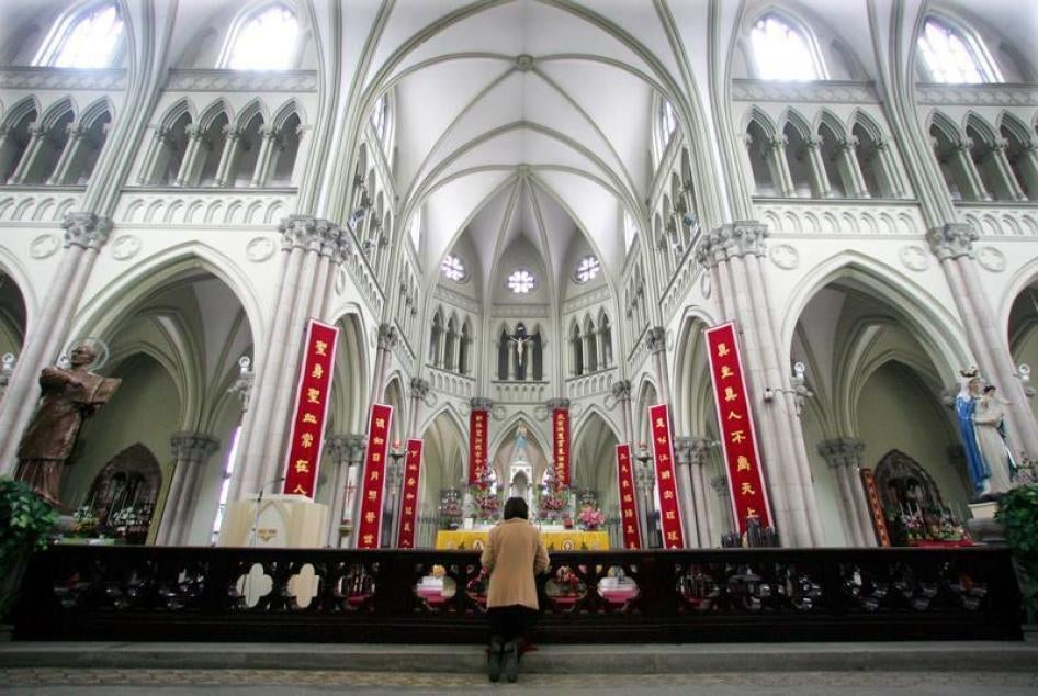 A Chinese Catholic prays on Easter Sunday at the state-sanctioned Saint Ignatius Cathedral in Shanghai.