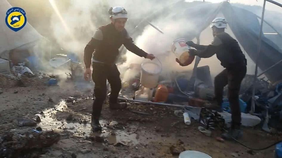 Local Civil Defence Forces extinguishing flames in tent after Syrian government forces shelling hit Khirmash displaced persons camp in Syria on Turkey’s border on April 14, 2016. 