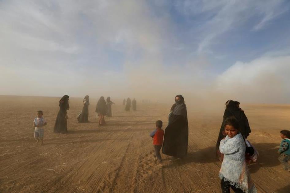 Civilians return to their village after it was retaken by anti-ISIS forces, south of Mosul, Iraq, October 21, 2016. 
