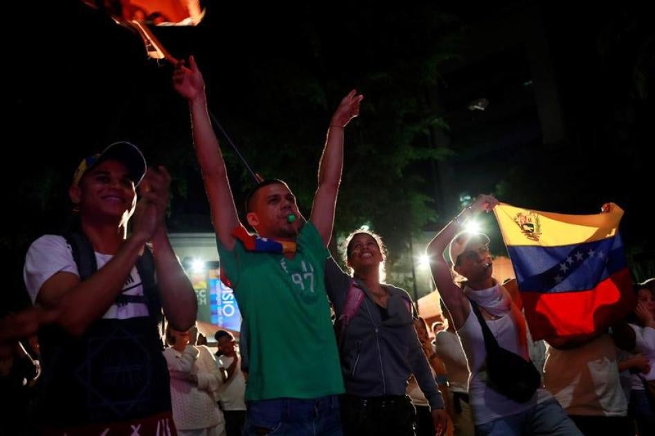 Opposition supporters react while waiting for results of the unofficial plebiscite against President Nicolas Maduro's government and his plan to rewrite the constitution, in Caracas, Venezuela July 16