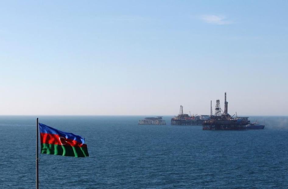 An Azerbaijan state flag flutters in the wind on an oil platform in the Caspian Sea east of Baku, January 22, 2013. 
