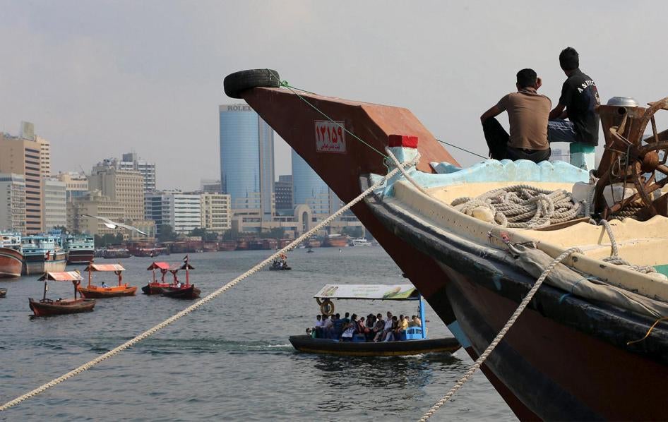 Iranian workers rest on a commercial ship at Dubai Creek, January 17, 2016. 