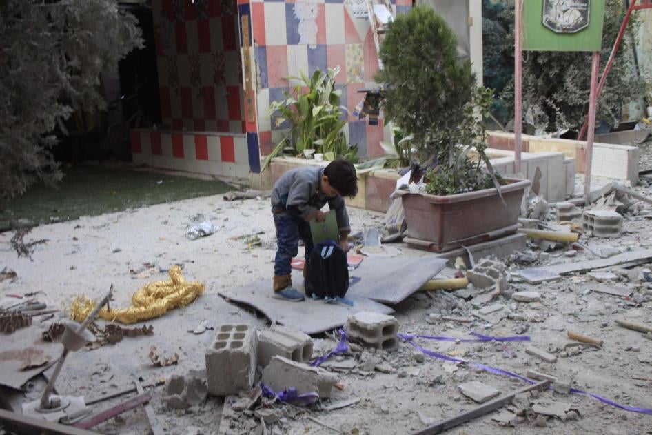 A boy packs his backpack at the Tamayuz (“Excellence”) kindergarten after the November 8 airstrike. © 2017 Private