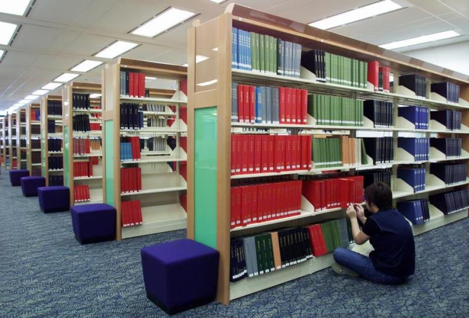 A library worker indexes periodicals at the Hong Kong Central Library May 14, 2001. 