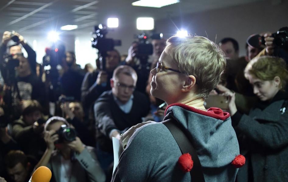 The media photograph Marina Zolotova, editor-in-chief of news portal tut.by, as she attends her trial for alleged 'unauthorised access' to information from state-run BelTA news agency, in Minsk, March 4, 2019. © 2019 SERGEI GAPON/AFP/Getty Images