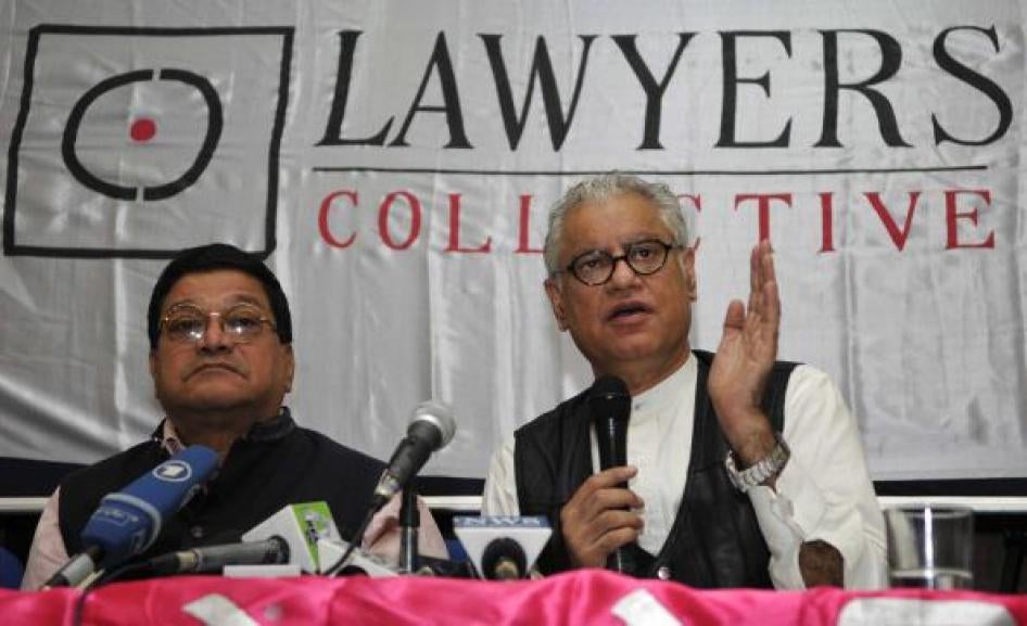 Lawyers Collective co-founder Anand Grover (right) speaks with the media after the Supreme Court's verdict on section 377 of the Indian Penal Code, December 11, 2013, in New Delhi. 