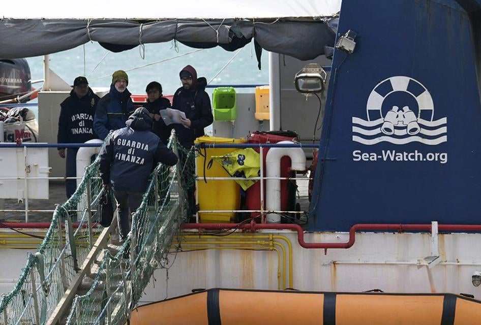 Italian Finance Police board the rescue ship Sea-Watch 3 after it disembarked 47 migrants at the Sicilian port of Catania, southern Italy, January 31, 2019.