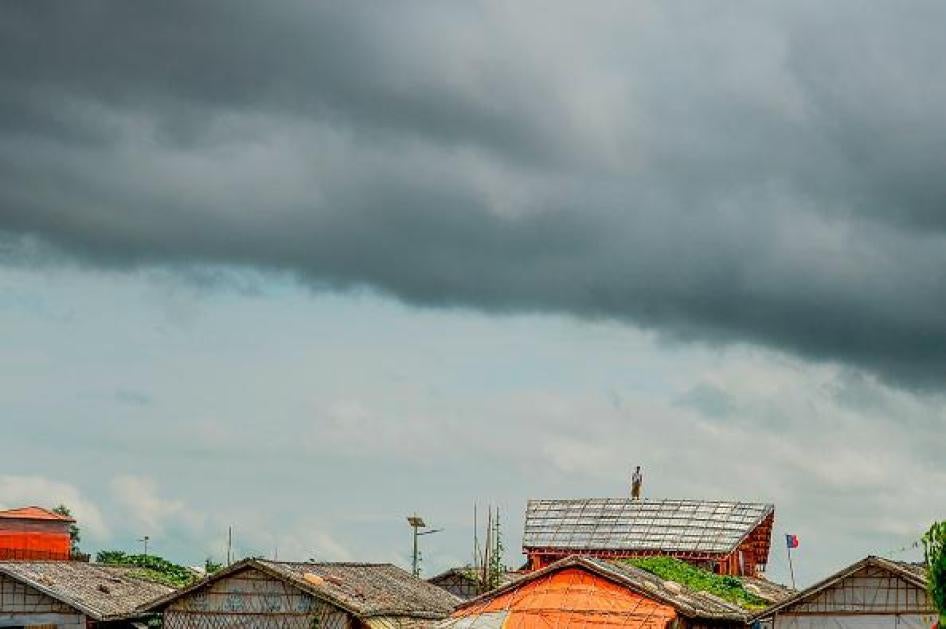 A Rohingya refugee man stands on a makeshift house at the Kutupalong refugee camp in Ukhia on Setember 13, 2019. (Photo by MUNIR UZ ZAMAN / AFP) (Photo credit should read MUNIR UZ ZAMAN/AFP/Getty Images)