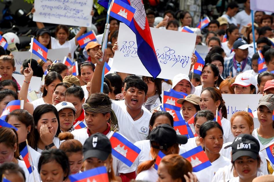 Workers march along a street to mark International Labour Day in Phnom Penh on May 1, 2019.