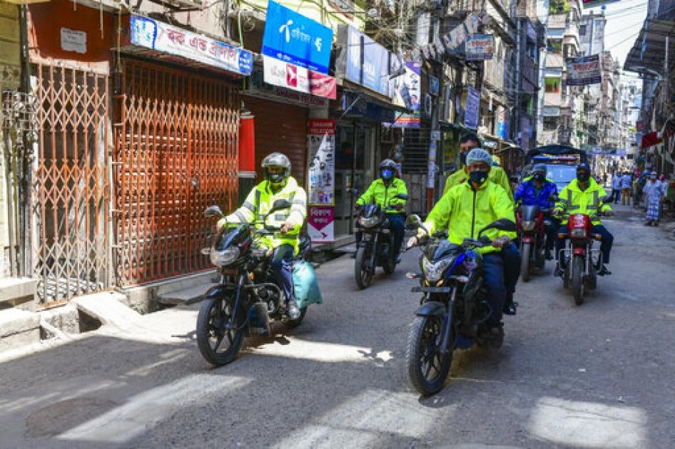 Police members wear protective equipment as they patrol the streets during the nationwide lockdown as a preventive measure against the Coronavirus outbreak, in Dhaka, Bangladesh, March 2, 2020. 
